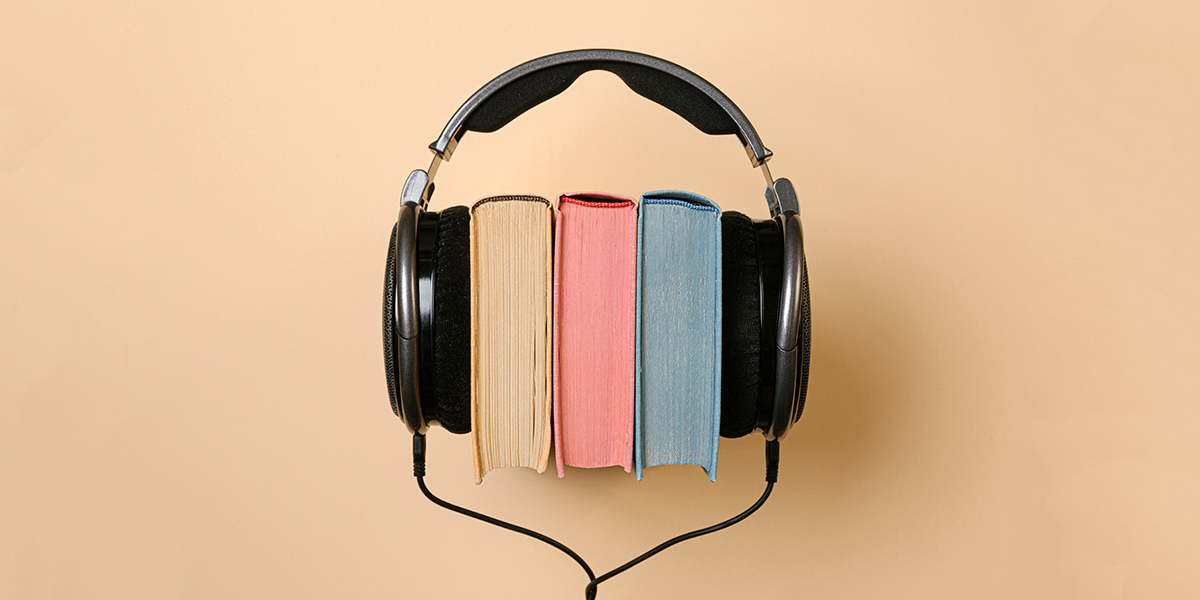a pair of headphones on top of books